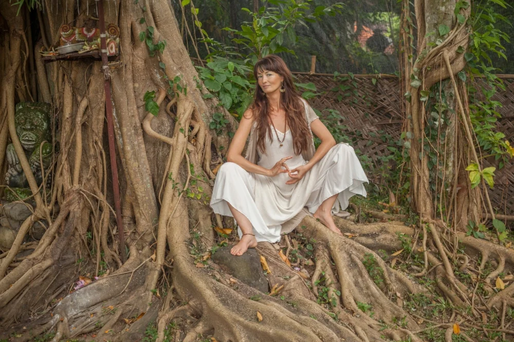 Robyn sitting beneath a mother tree in Bali